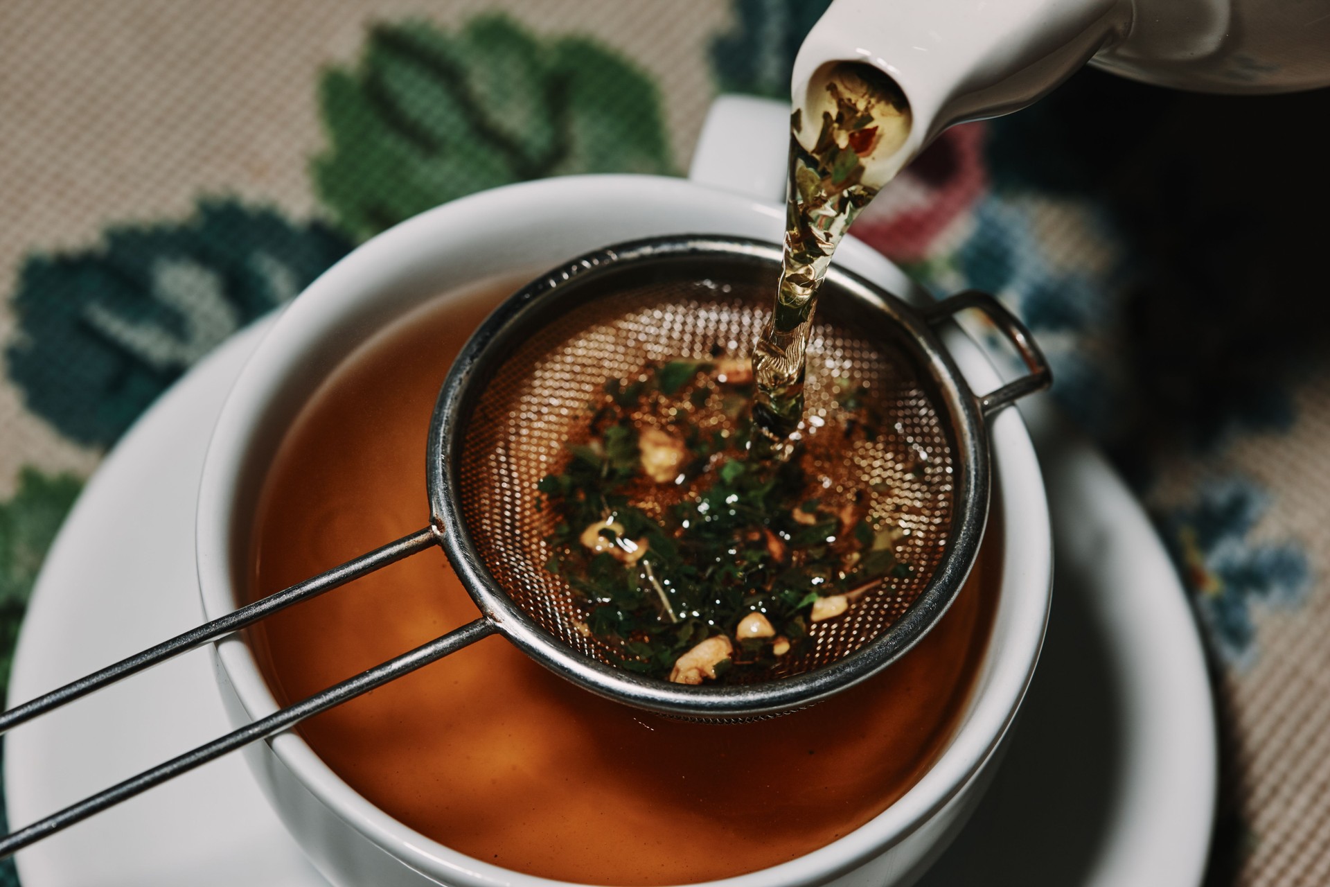 Pouring herbal tea series of images